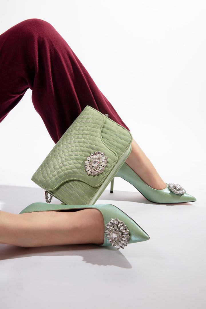Women heels in light green colour with pointed toe and diamond flower buckle by JULKE