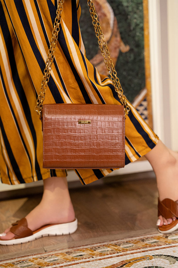 Womens leather shoulder bag in brown colour with croc texture and gold chain by JULKE